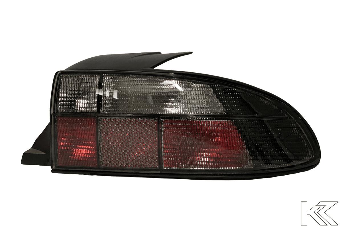 BMW Z3 OEM style smoked tail lights by K2 Industries, featuring sleek, tinted design for 1990-1999 models.