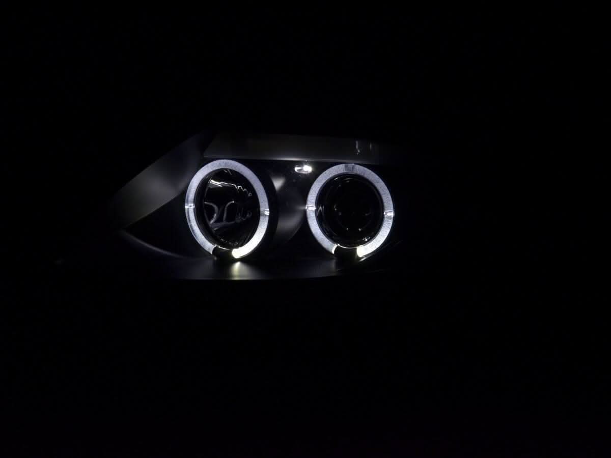BMW Z4 E85 E86 black headlight set by K2 Industries, showing the sleek design and clear lens for 2003-2008 models.