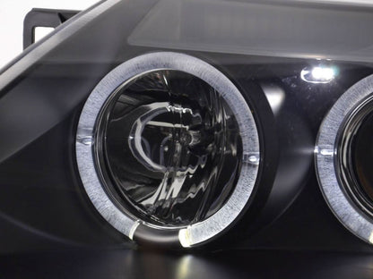 Black BMW Z4 E85/E86 Type Z4 headlight set from K2 Industries for 2003-2008 models, showing close-up of headlight lenses and housing.