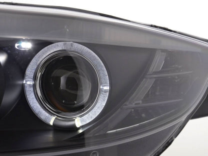 Black headlight set for BMW Z4 E85 E86 (2003-2008) by K2 Industries, featuring dual headlights with clear lenses and black housing.