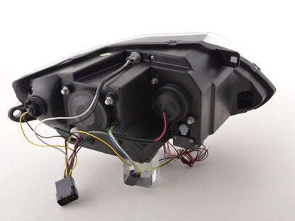 Pair of black BMW Z4 E85 E86 headlights by K2 Industries for 2003-2008 model, featuring sleek design and clear lens covers.