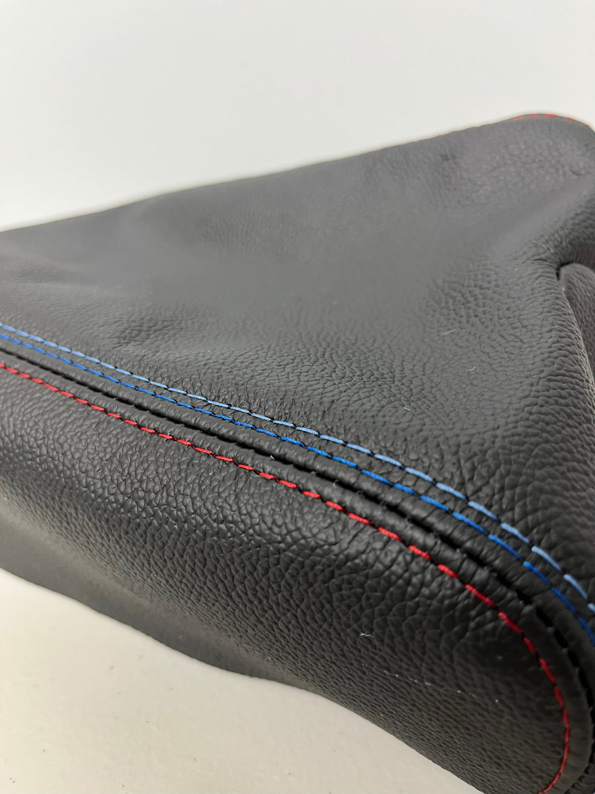 Black leather console shift and parking brake boot cover for BMW E46, made by JTS Custom Upholstery, fits 1991-2005.