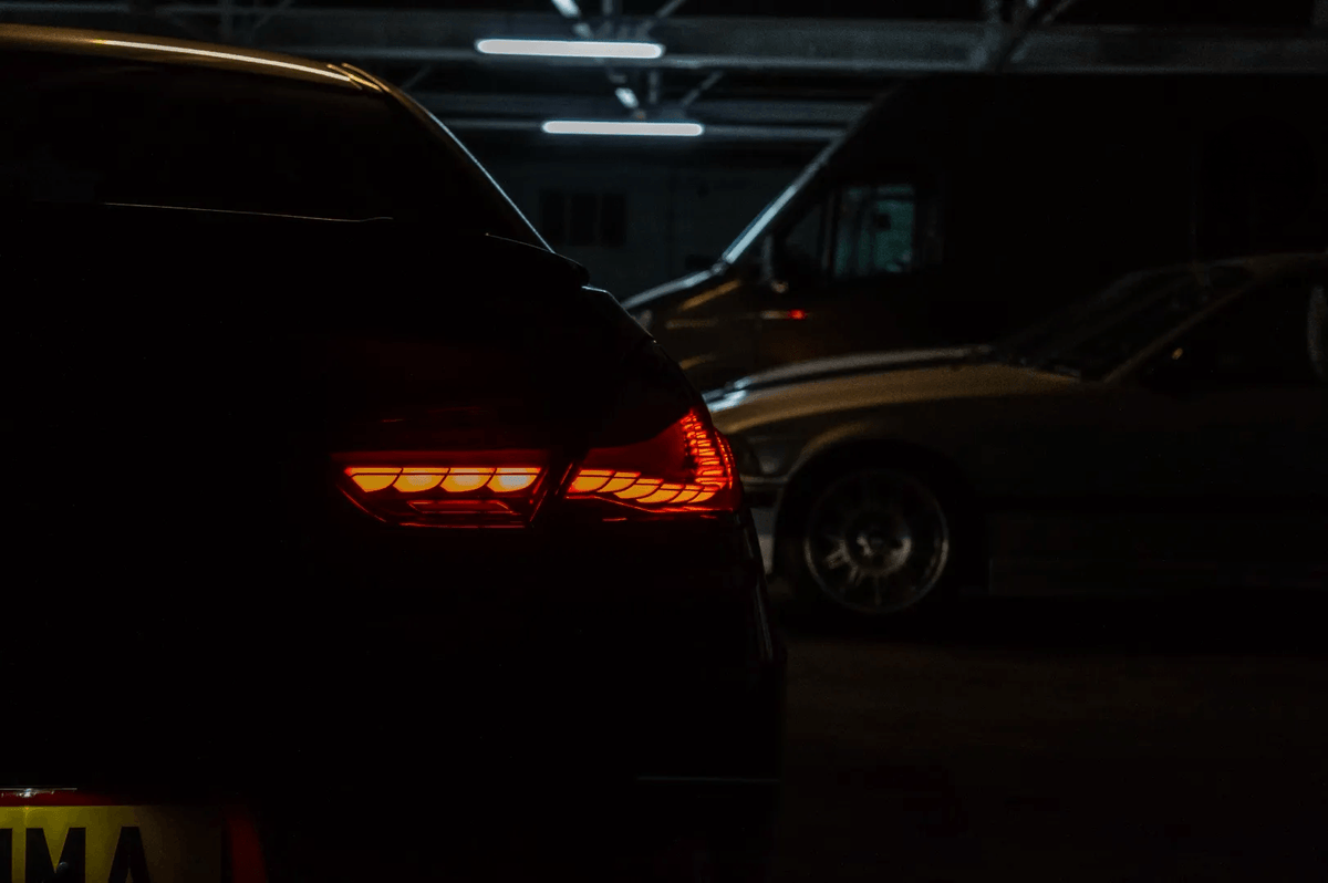BMW 6 Series F12 F13 F06 smoke and red GTS OLED style tail lights by K2 Industries installed on a 2011-2018 model.