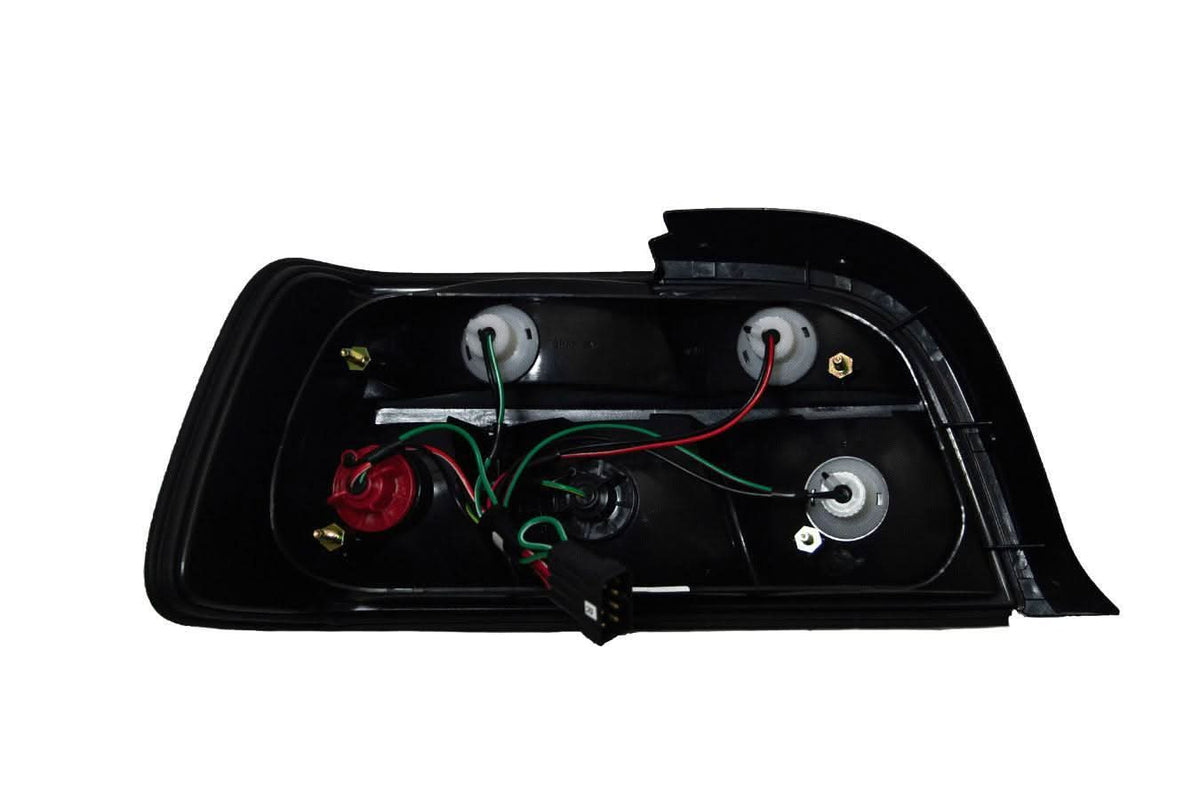 BMW E36 coupe smoked and clear tail lights by K2 Industries, featuring sleek design and durable construction for 1990-1999 models.