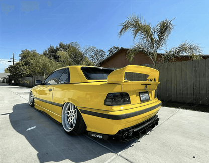 BMW E36 coupe smoked and clear tail lights by K2 Industries, showing the sleek design and lens details for 1990-1999 models.