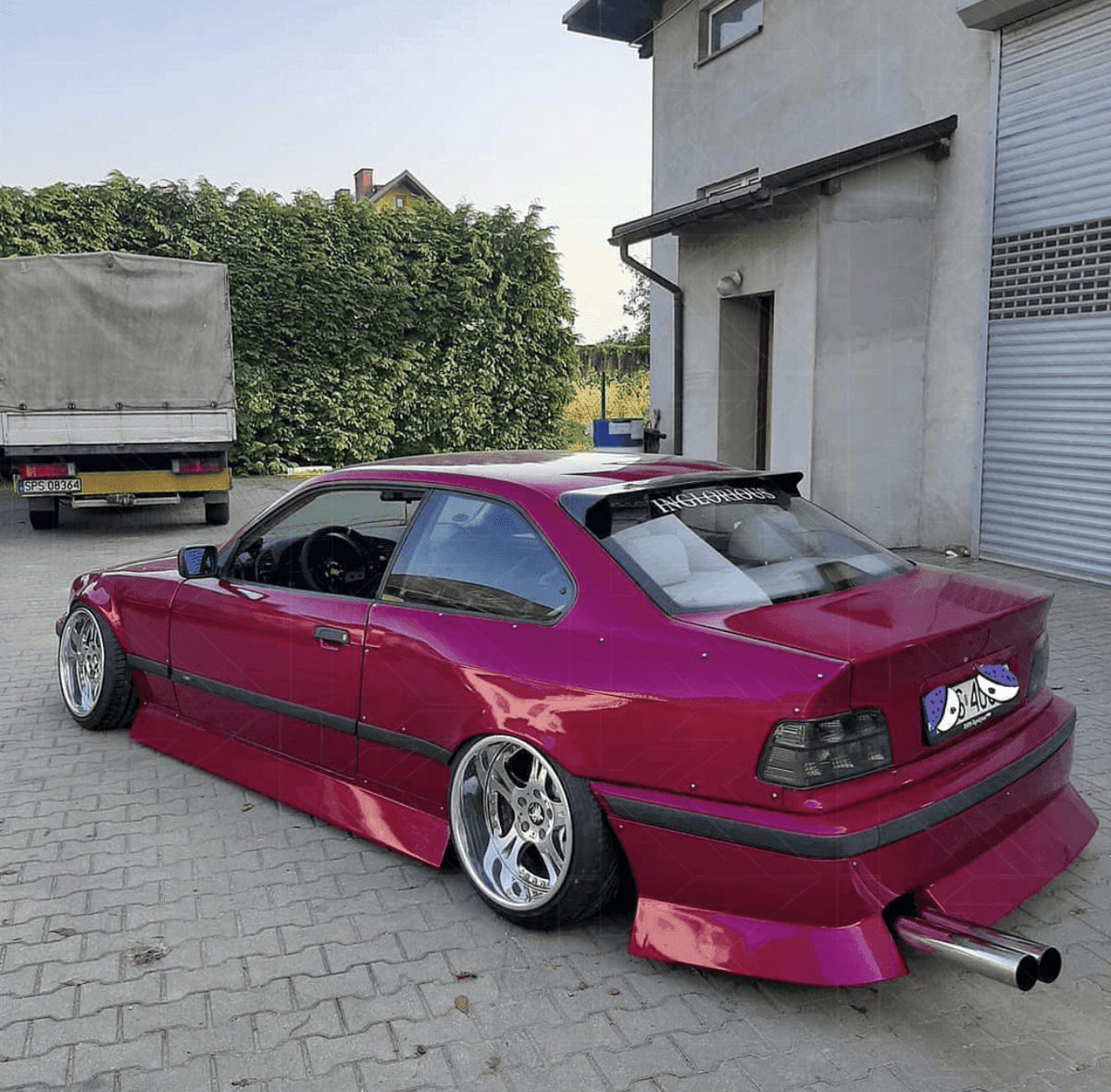 BMW E36 Coupe smoked and clear tail lights by K2 Industries, designed for 1990-1999 models, showing detailed lens and mounting features.