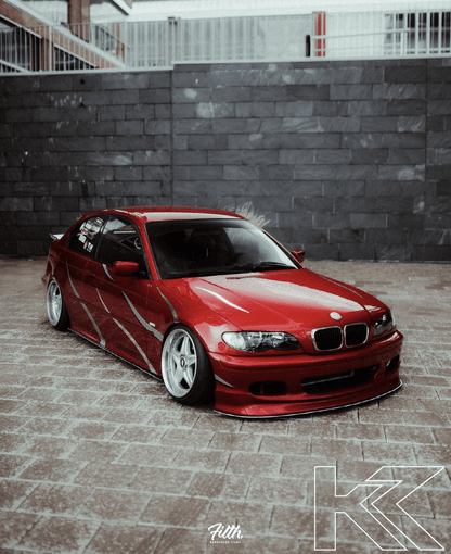 BMW E46 Sedan/Touring front lip in JDM style V1 by K2 Industries, showcasing the aerodynamic design and fitment for 1999-2006 models.