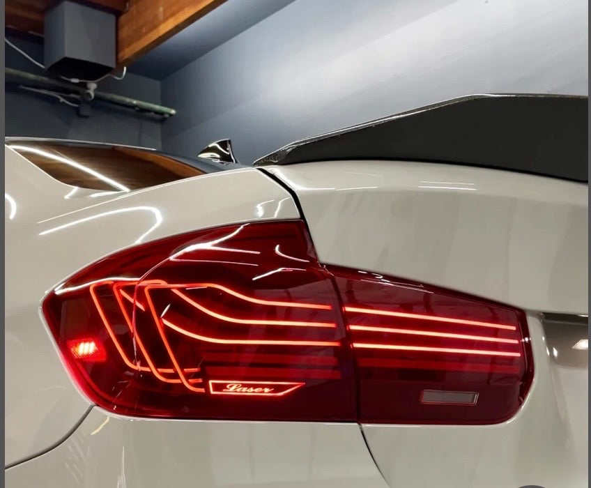BMW F30 and M3 F80 CSL laser tail lights by Palenon Performance, showing sleek, modern design with illuminated LED elements.