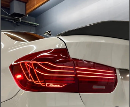 BMW F30 and M3 F80 CSL laser tail lights by Palenon Performance, showing sleek, modern design with illuminated LED elements.