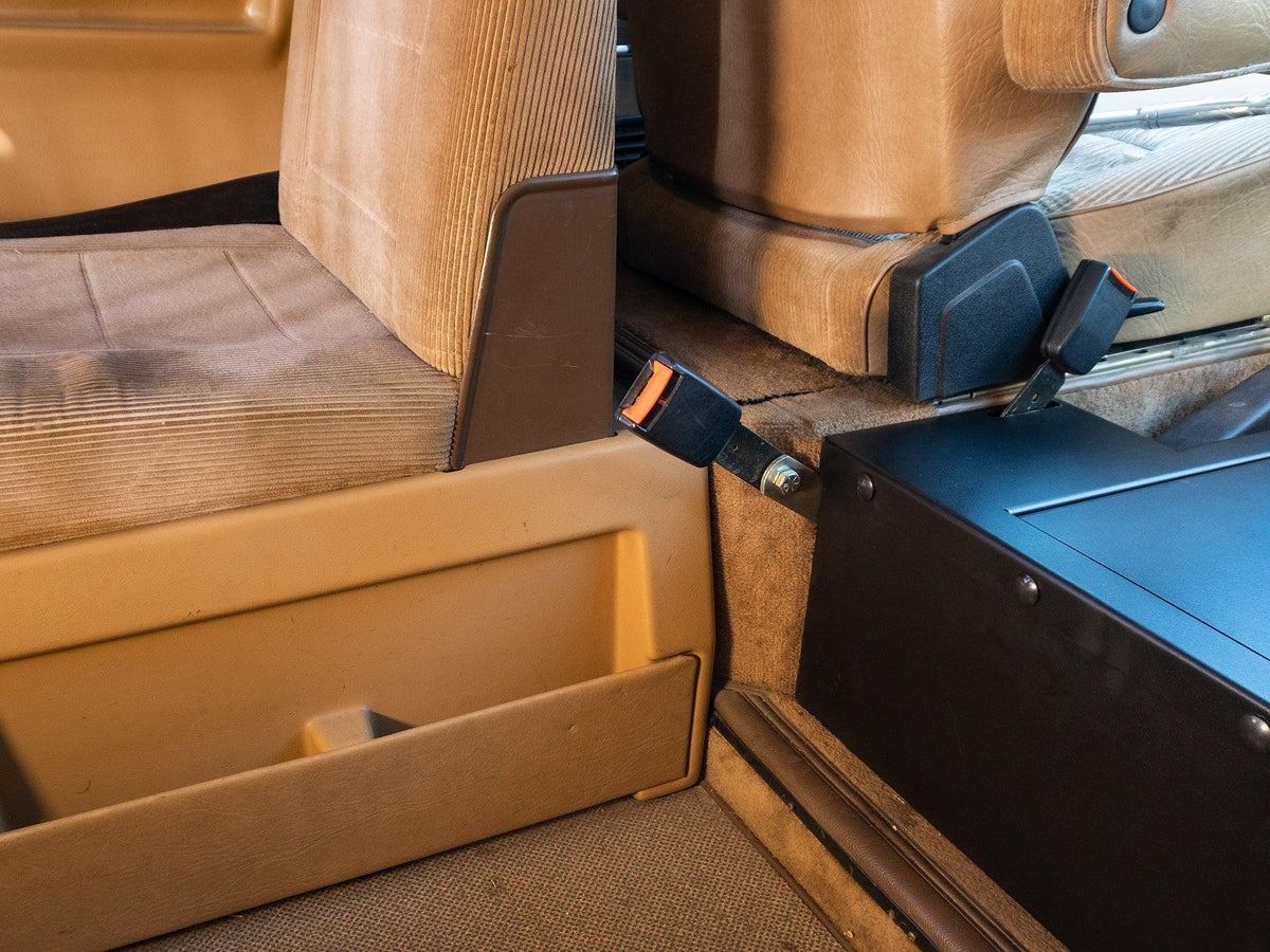 GoWesty seat belt receiver extension kit showing a compact, durable extension device attached to a vehicle seat belt.