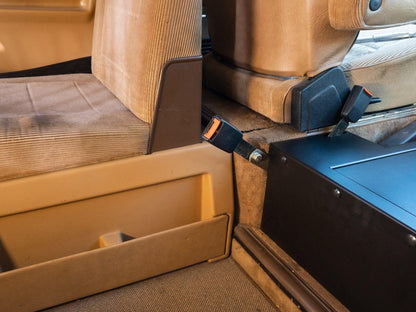 GoWesty seat belt receiver extension kit showing a compact, durable extension device attached to a vehicle seat belt.