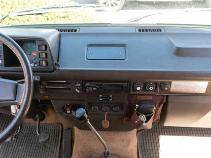 GoWesty Vanagon Ashtray Delete Kit front view showing sleek, custom black panel replacing the original ashtray in the vehicle interior.