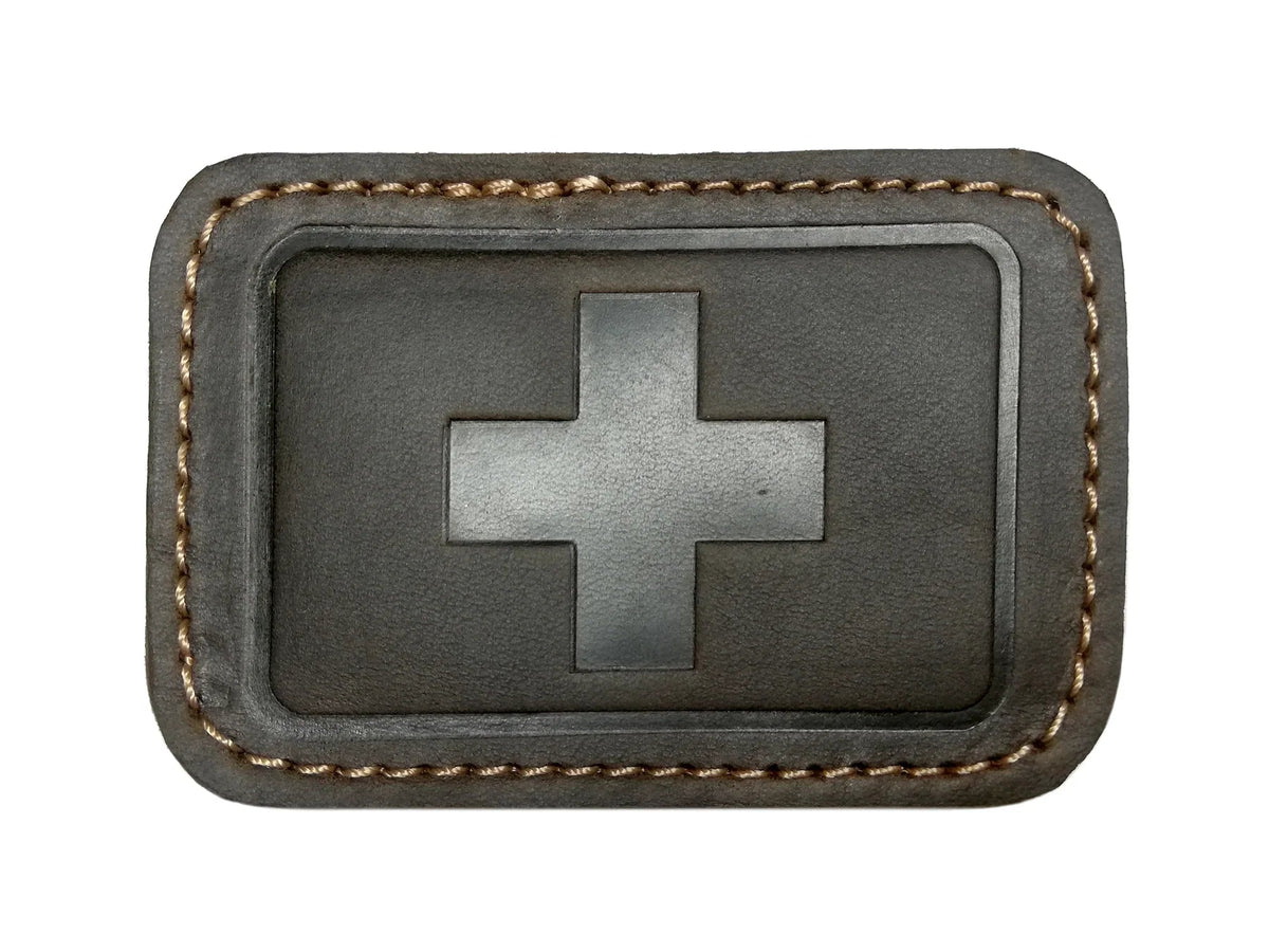 GoWesty leather patches for combi bags, close-up view showing textured brown leather patches on bag surface.