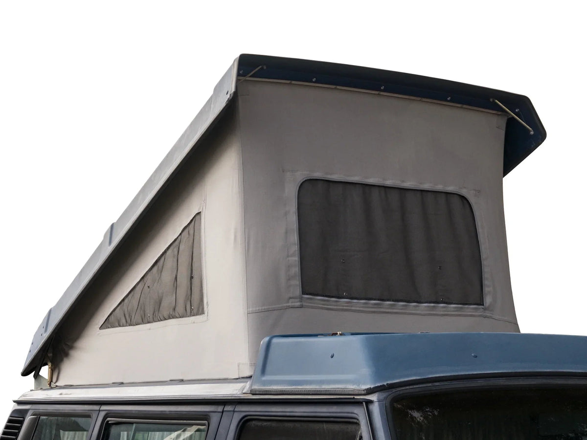 GoWesty cotton pop-top tent for late Vanagon camper, showing the fully extended tent with fabric and window details.