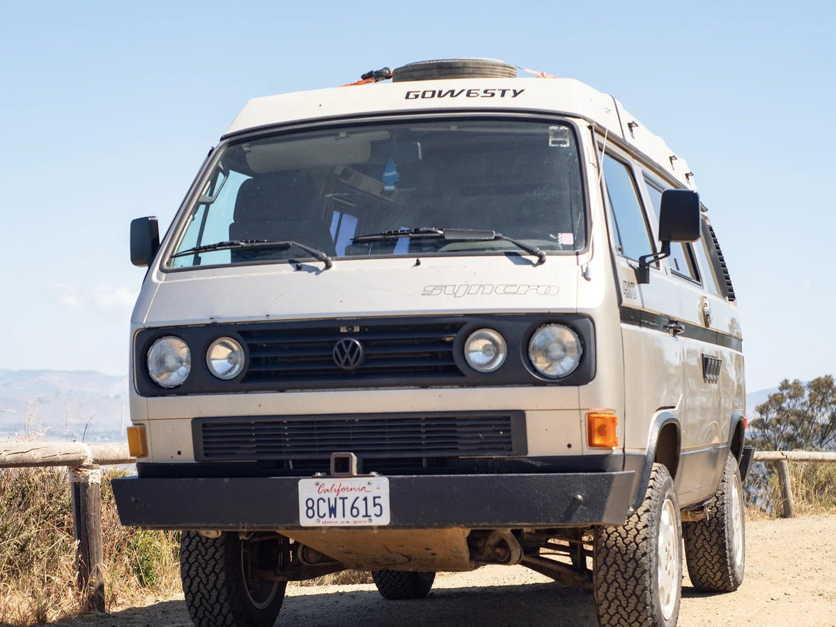GoWesty Deluxe Manual Mirror Kit for Vanagon showing two side mirrors with mounting hardware and black finish.
