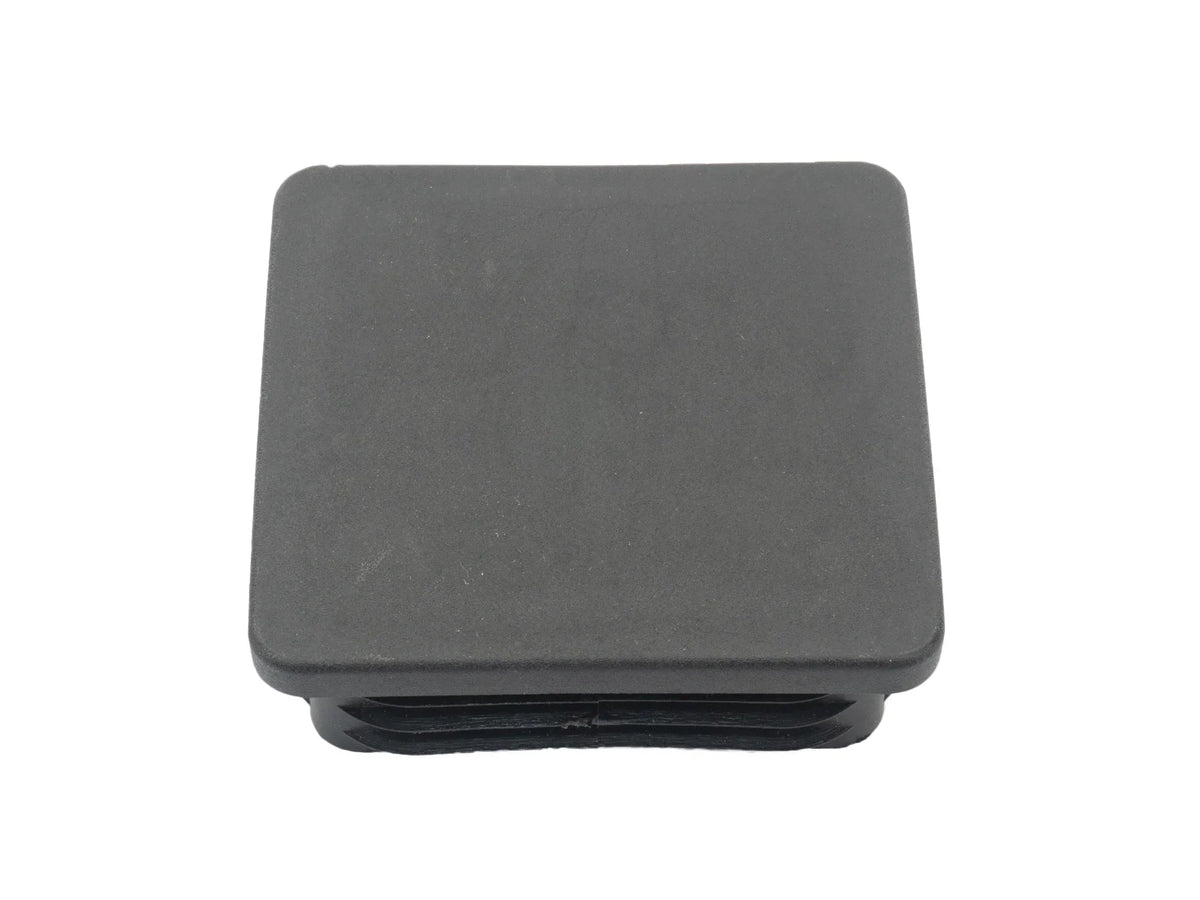 Black square snap-in hitch hole cap by GoWesty, designed to cover and protect trailer hitch receiver opening.
