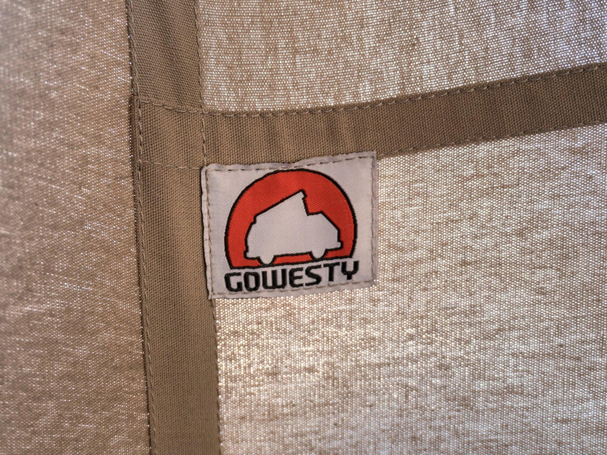 GoWesty cotton pop-top tent set up on a late Vanagon camper, showcasing the durable fabric and spacious design for outdoor camping.