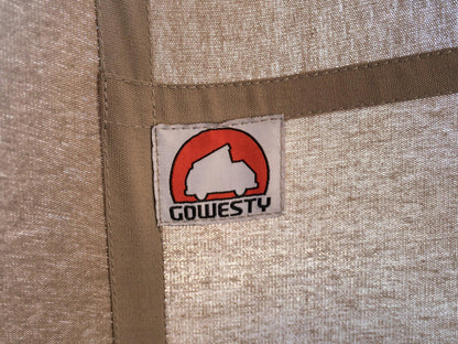 GoWesty cotton pop-top tent set up on a late Vanagon camper, showcasing the durable fabric and spacious design for outdoor camping.