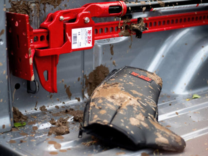 GoWesty Hi-Lift Jack Cover in black fabric, shown fitted over a Hi-Lift jack.