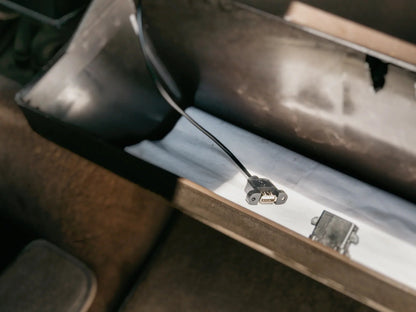 GoWesty USB charging port conversion for map light, showing the compact device installed in a vehicle interior