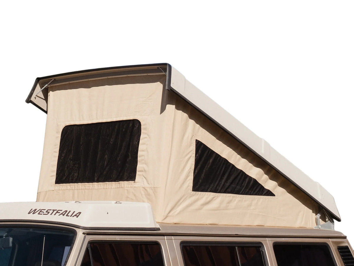 GoWesty cotton pop-top tent set up on a late Vanagon camper for outdoor camping and van conversion adventures.