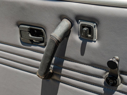 GoWesty interior leather trim kit showing detailed close-up of black leather pieces and stitching for vehicle interior upgrade.