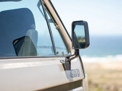 GoWesty Deluxe Manual Mirror Kit for Volkswagen Vanagon with two adjustable side mirrors and mounting hardware.