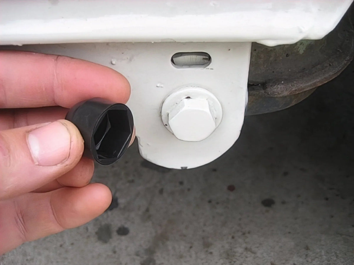 Pair of GoWesty pivot bolt caps for Vanagon rear suspension, designed to protect and secure suspension components.