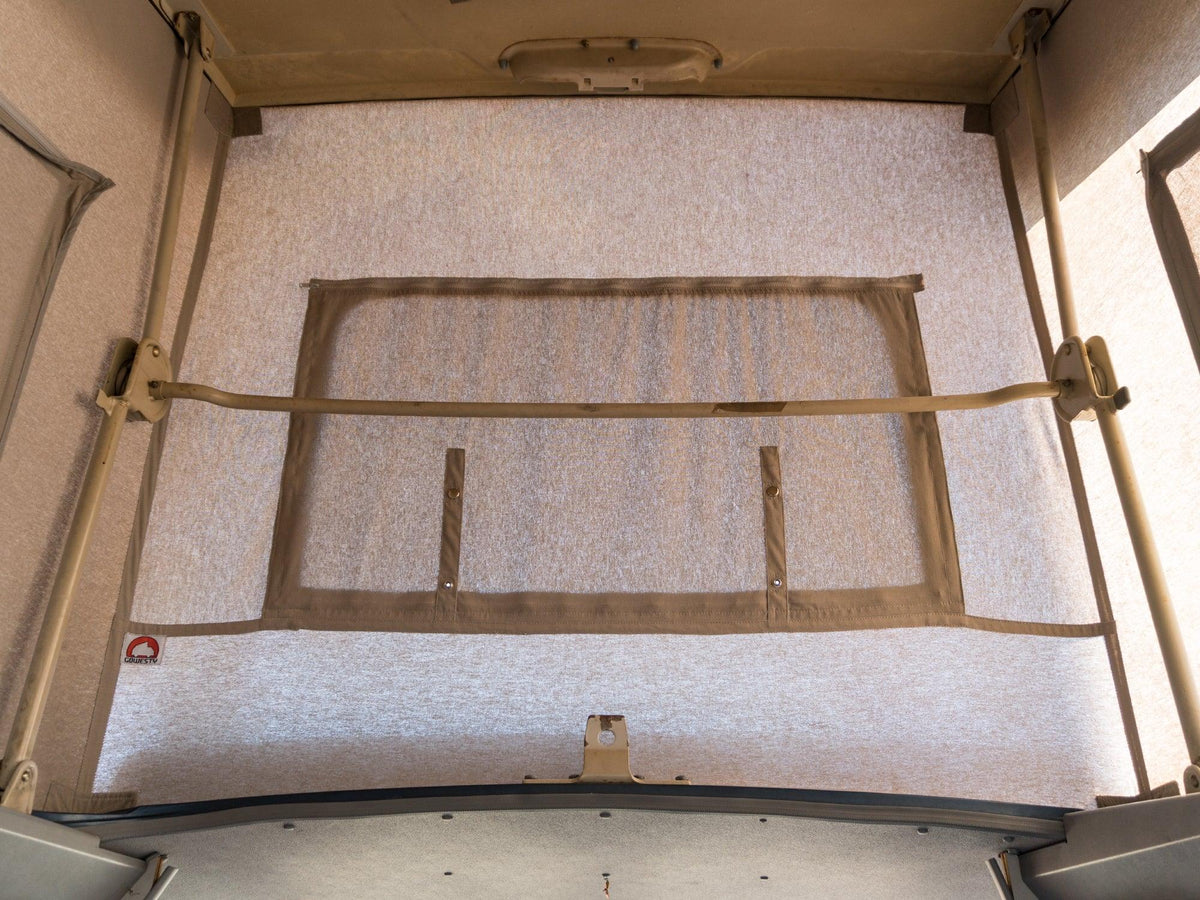 GoWesty cotton pop-top tent mounted on a late Vanagon camper van, showcasing its fabric and installation details.