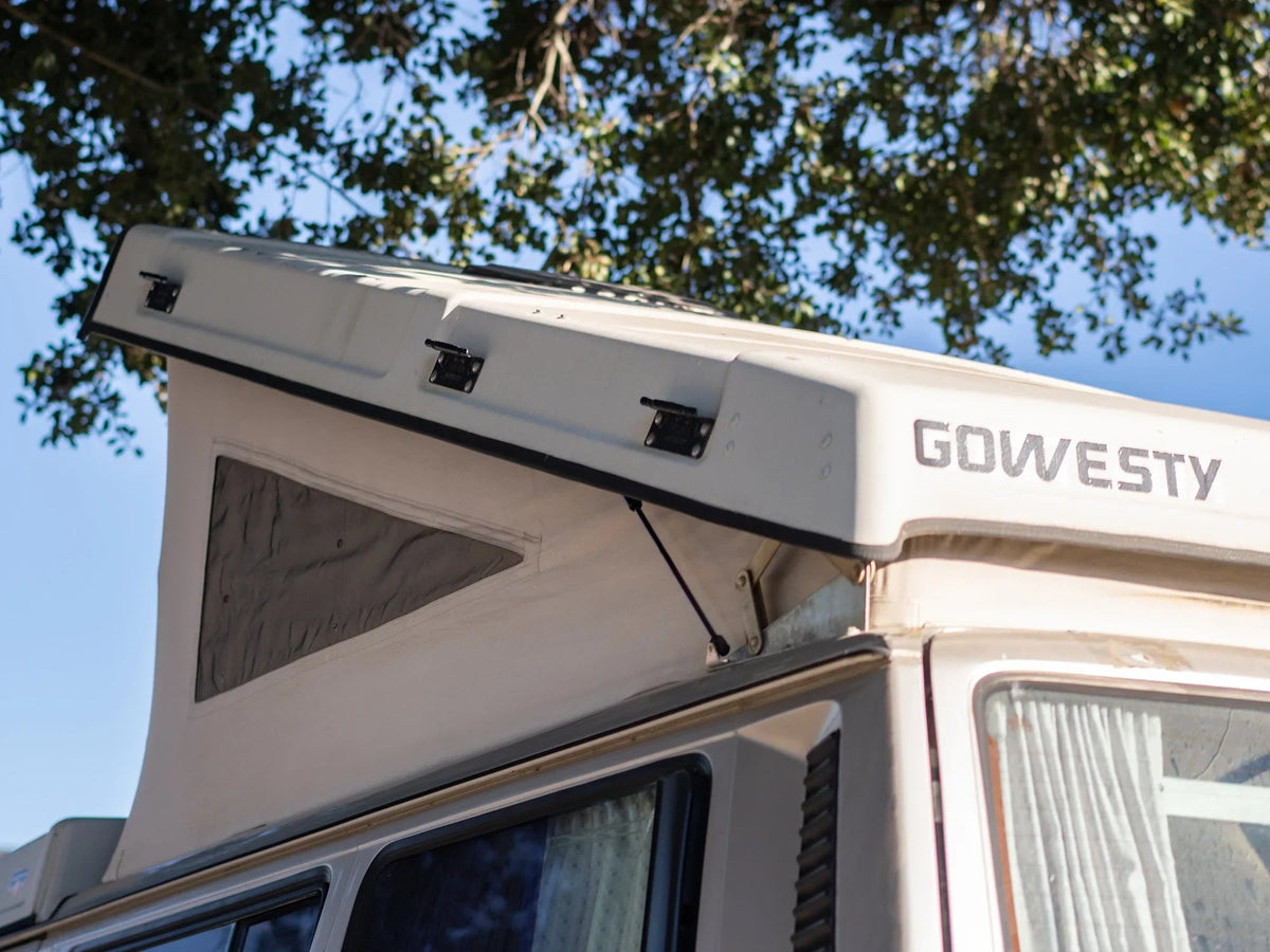 GoWesty Pop-Top Lift Assist Basic Kit for Vanagon, showing the compact mechanical components and installation parts.