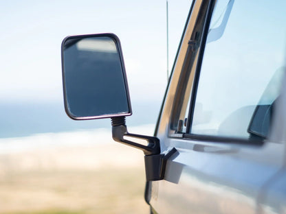 GoWesty Deluxe Manual Mirror Kit for Vanagon showing two side mirrors with mounting brackets and adjustment features.