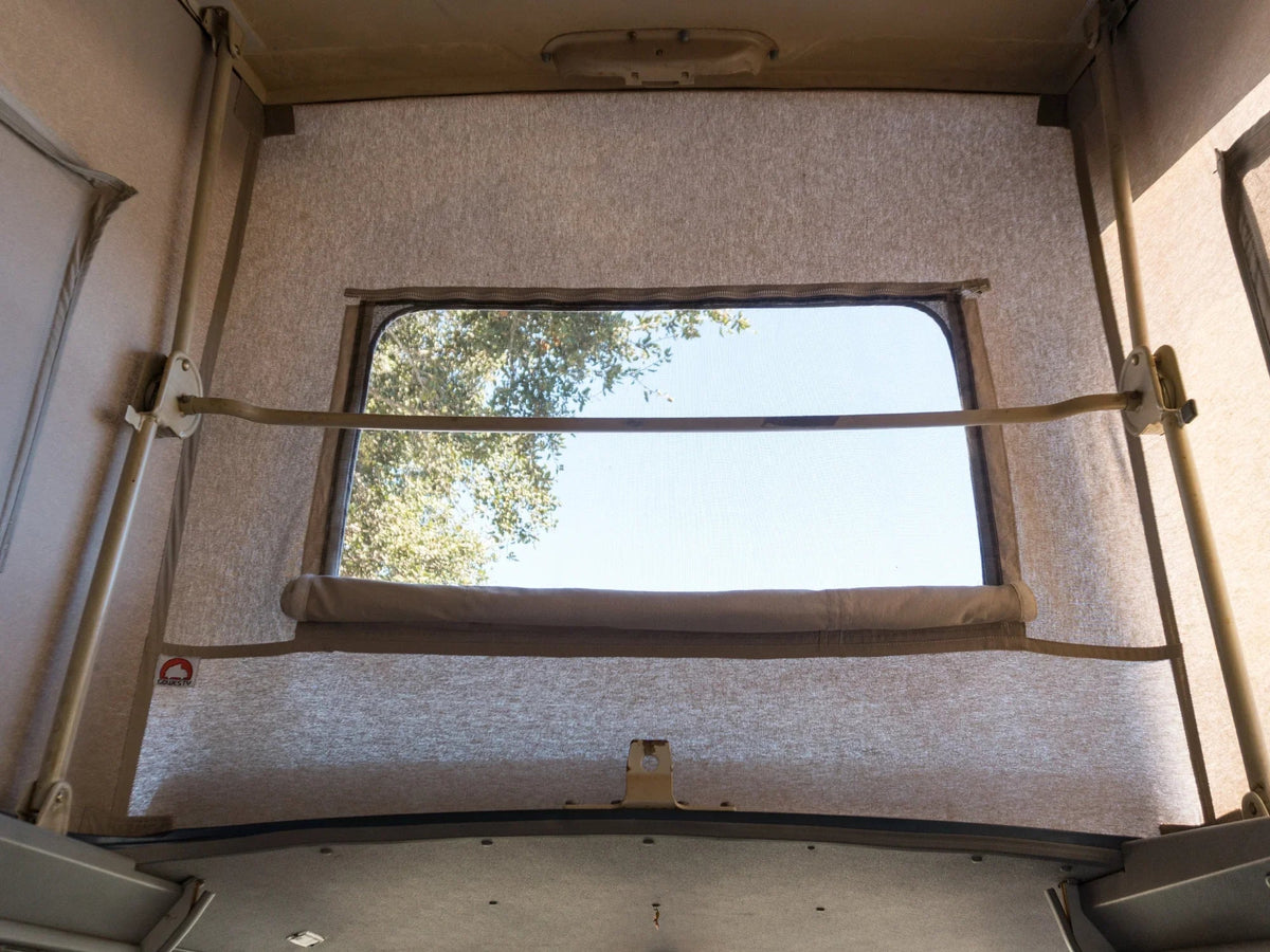 GoWesty Pop-Top Tent for late Vanagon camper, made of durable cotton fabric, shown fully set up on camper van roof.