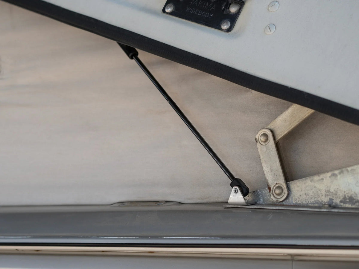 GoWesty Pop-Top Lift Assist Basic Kit installed on a Vanagon, showing the compact mechanism supporting the pop-top lift.