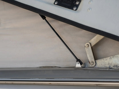 GoWesty Pop-Top Lift Assist Basic Kit installed on a Vanagon, showing the compact mechanism supporting the pop-top lift.