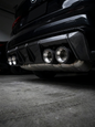 Set of four carbon fiber exhaust tips for BMW M series, featuring sleek black finish and 60-80mm inlet size, by K2 Industries.