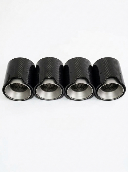 Set of four carbon fiber exhaust tips for BMW M series, 60-80mm inlet, featuring sleek black finish and brand logo.
