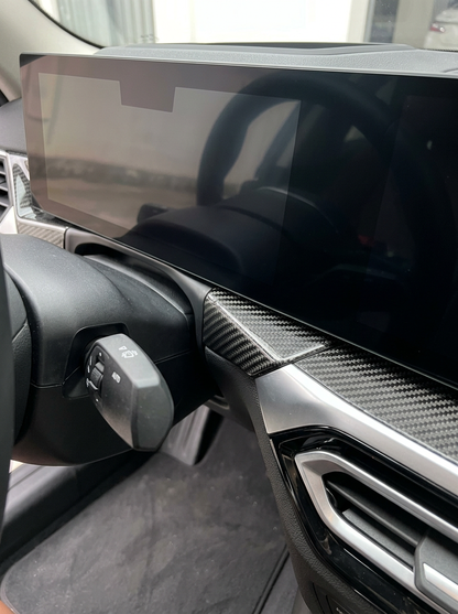 BMW 3/4 Series G80/G81/G82/G83/G87 carbon fiber dashboard trim by K2 Industries, shown installed inside the vehicle.