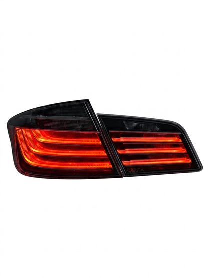 BMW 5 Series F10 2011-2017 BlackLine Style LED tail lights by K2 Industries, showing sleek black housing and LED light pattern.