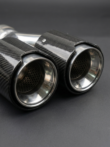 BMW universal fit carbon fiber dual muffler tips by K2 Industries, showcasing sleek black carbon fiber finish and polished metal tips.
