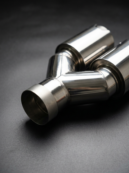 BMW universal fit carbon fiber dual muffler tips by K2 Industries, showing sleek, polished carbon fiber tips on a vehicle exhaust system.