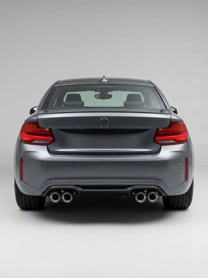 BMW universal fit carbon fiber dual muffler tips by K2 Industries, showing sleek, shiny carbon fiber tips attached to a vehicle.