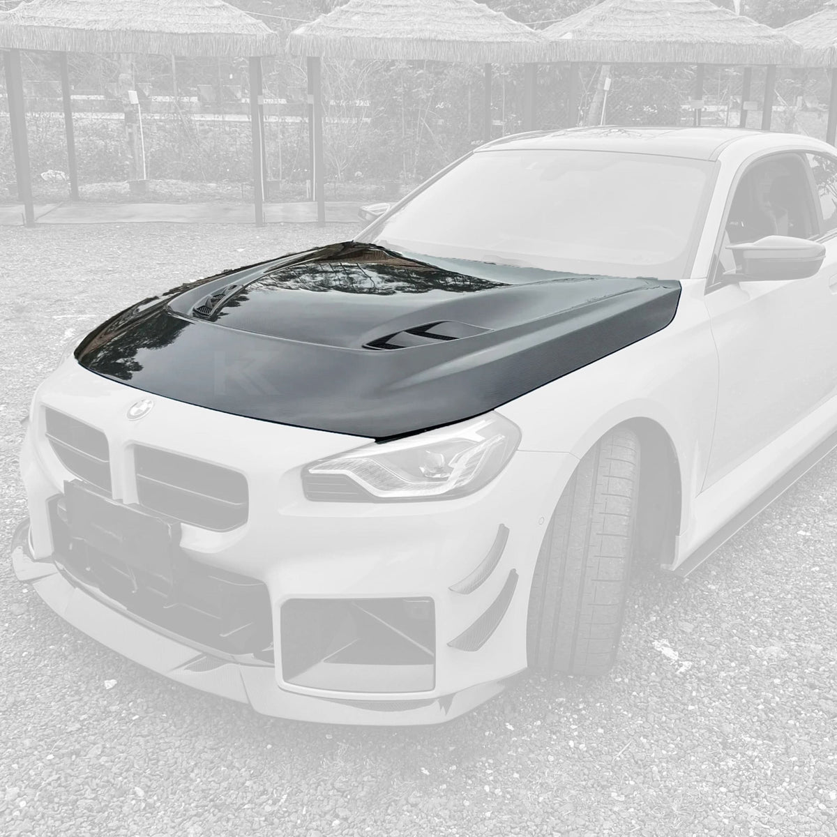 BMW 2 Series G87 M2 carbon fiber hood by K2 Industries, showcasing lightweight, glossy black carbon fiber material with aerodynamic design.
