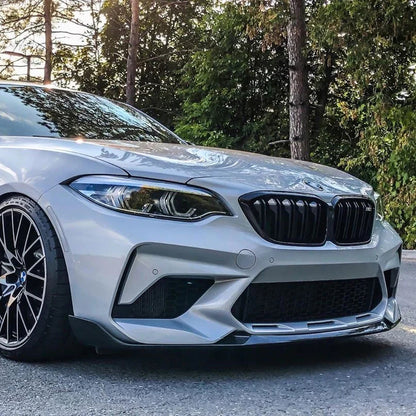 Carbon fiber M Style front lip for BMW F87 M2 (2016-2018) by Palenon Performance, showcasing sleek design and textured finish.
