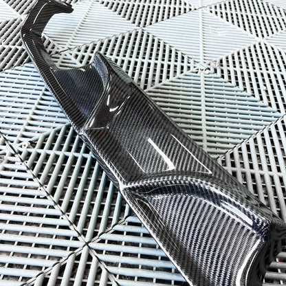 BMW 3/4 Series F80/F82/F83 carbon fiber diffuser by K2 Industries, showcasing sleek design and textured carbon fiber surface.