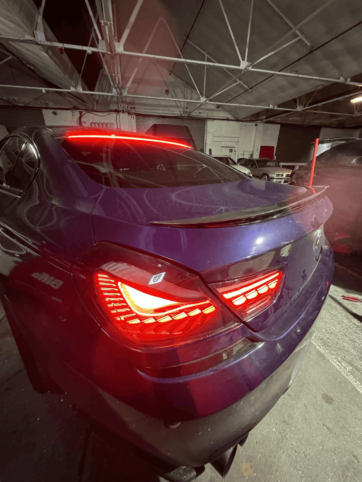 BMW 6 Series F12 F13 F06 smoke and red GTS OLED style tail lights by K2 Industries, showing sleek LED design on a 2011-2018 model.