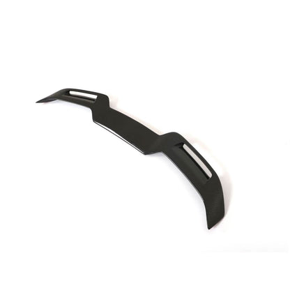 Carbon fiber V2 style trunk spoiler for BMW G22 430i and G82/G83 M4, featuring sleek aerodynamic design.