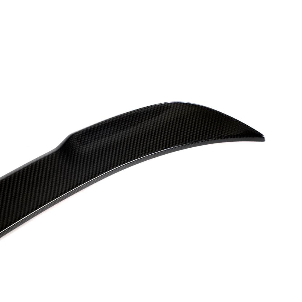 Dry carbon fiber rear trunk spoiler for BMW F30/F35 3 Series and F80 M3, showcasing sleek, lightweight racing-inspired design.