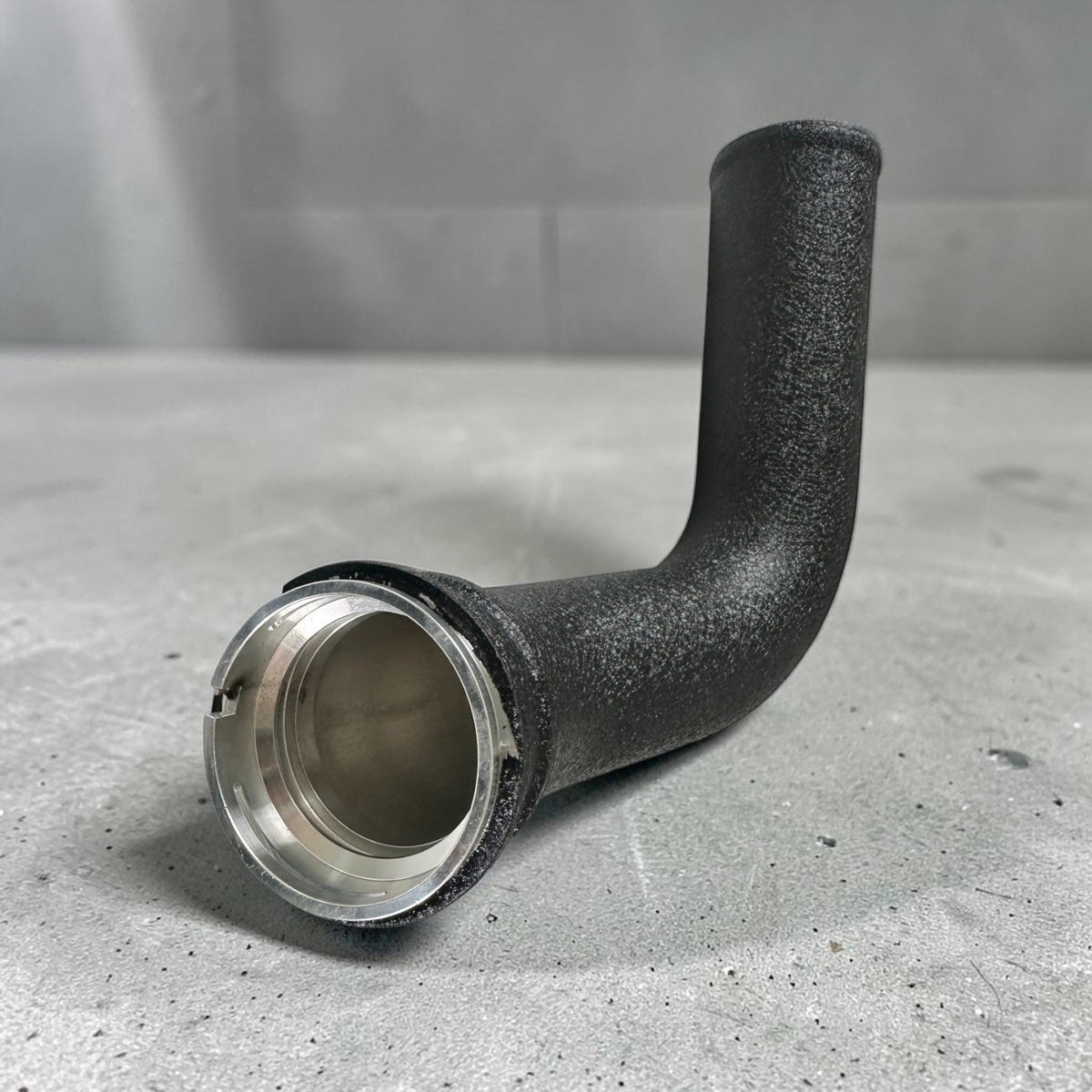 Palenon Performance B46 B48 charge pipe for BMW F & G chassis and Supra 2.0T, showing polished metal pipe with connection fittings.