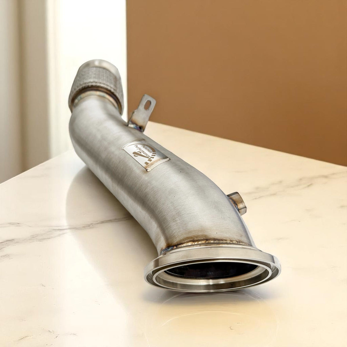 Palenon Performance B46 B48 Racing Downpipe for BMW and Toyota Supra, showing polished stainless steel exhaust pipe with flanges.