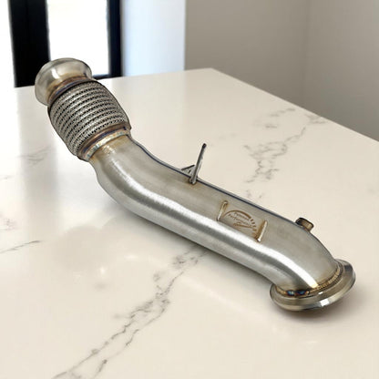 Palenon Performance B46 B48 Racing Downpipe installed on a BMW or Toyota Supra engine, showcasing high-performance exhaust upgrade.